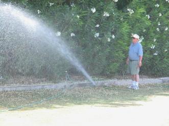 Chula Vista sprinkler repair technician surveys a new installation